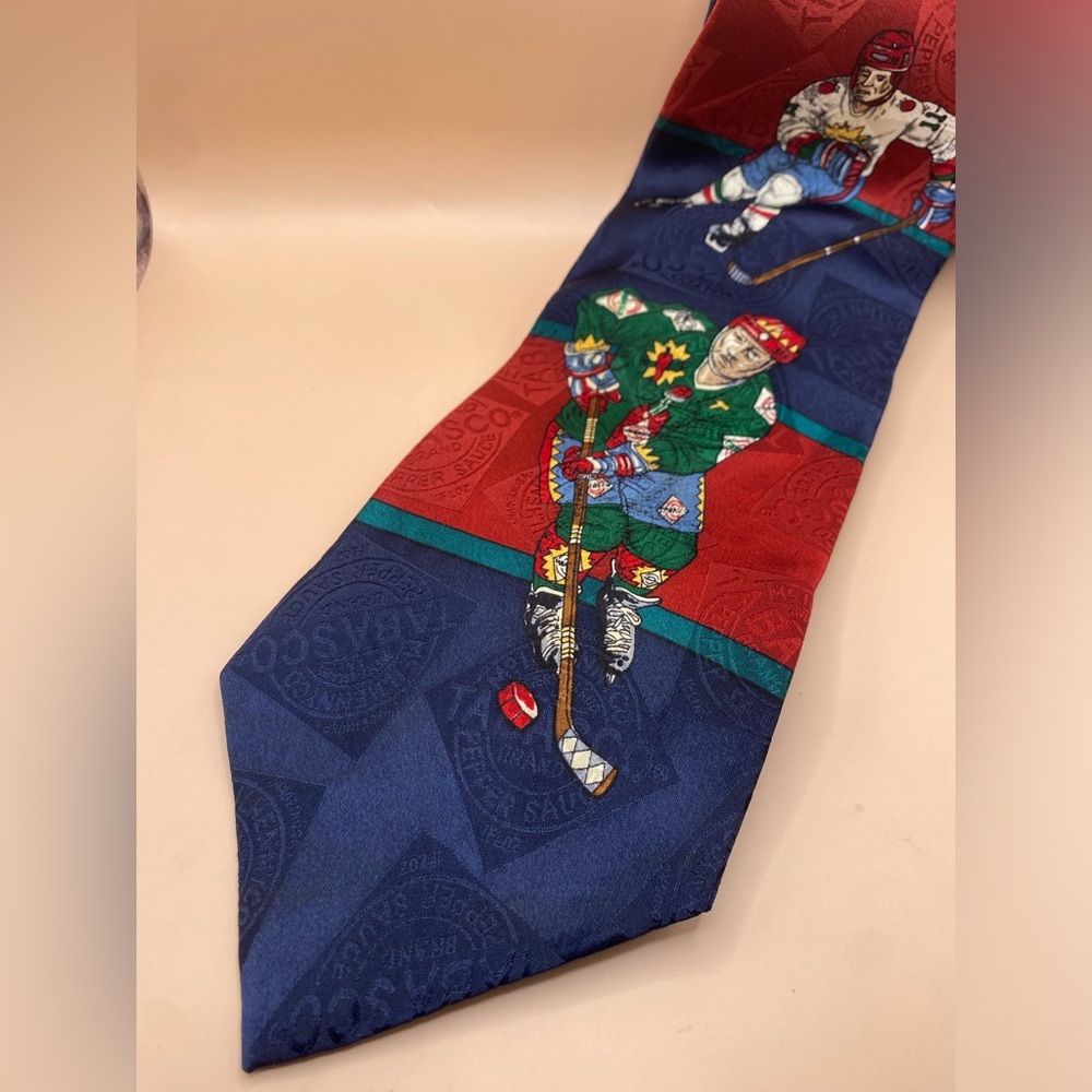 Tabasco necktie hockey players goalie puck stick skating‎